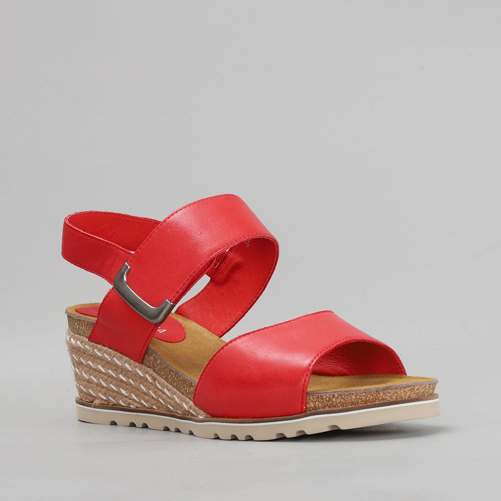 Le Sansa Evita red sandals with open toes and ankle straps, featuring a stylish design and comfortable fit.