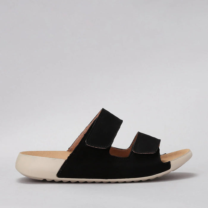 Black CC Resorts Evola flats shown from the side, featuring a sleek design with a rounded toe and flat sole.