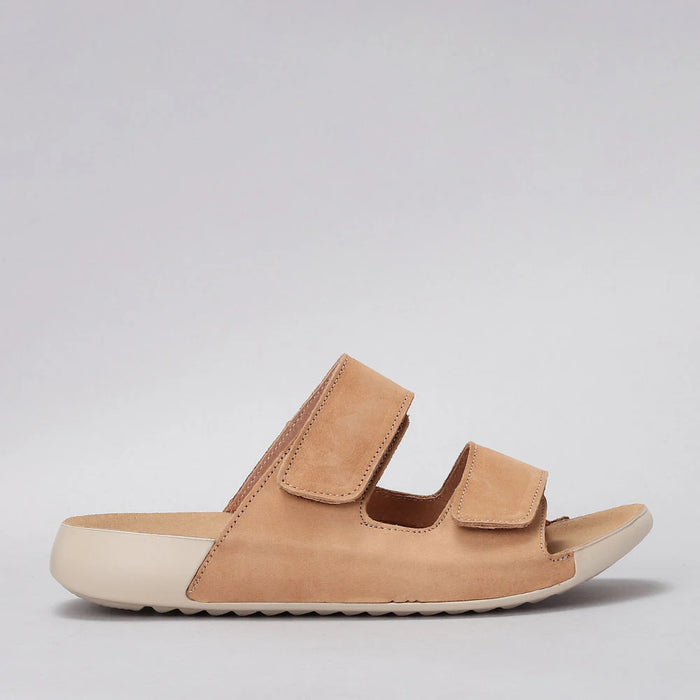 CC Resorts Evola Tan flats shown from the side, featuring a sleek design and neutral tan color, perfect for casual or dressy wear.