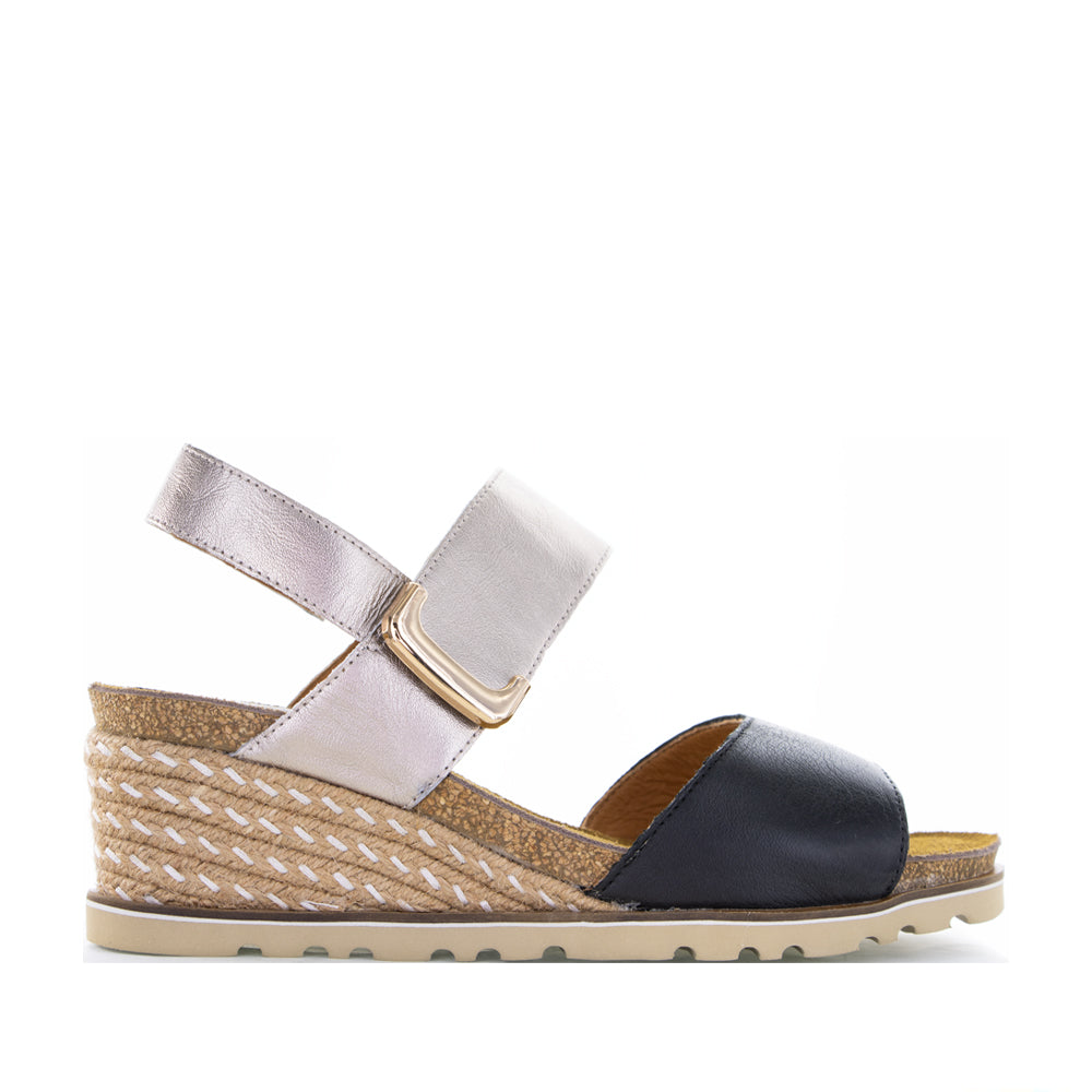 Le Sansa Evita black champagne sandals with sleek straps and elegant design, perfect for stylish summer wear.