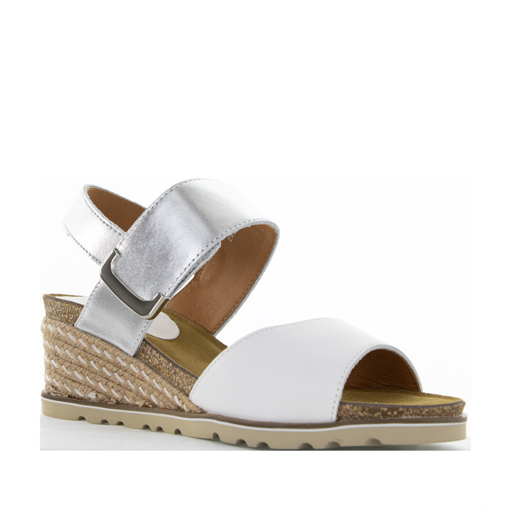 Le Sansa Evita white and silver sandals with sleek straps, stylish for casual or dressy summer wear.