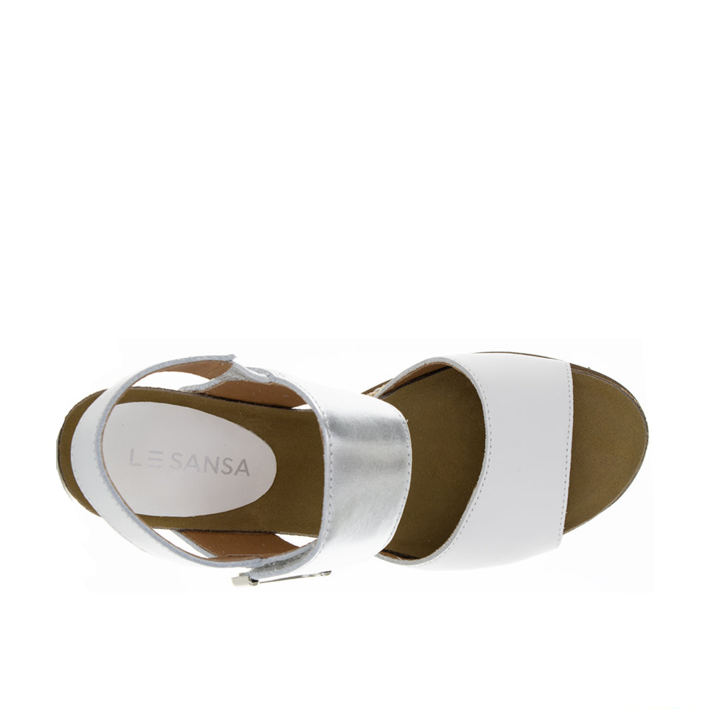 Le Sansa Evita white silver sandals with sleek straps and low heel, stylish and comfortable for casual or dressy occasions.