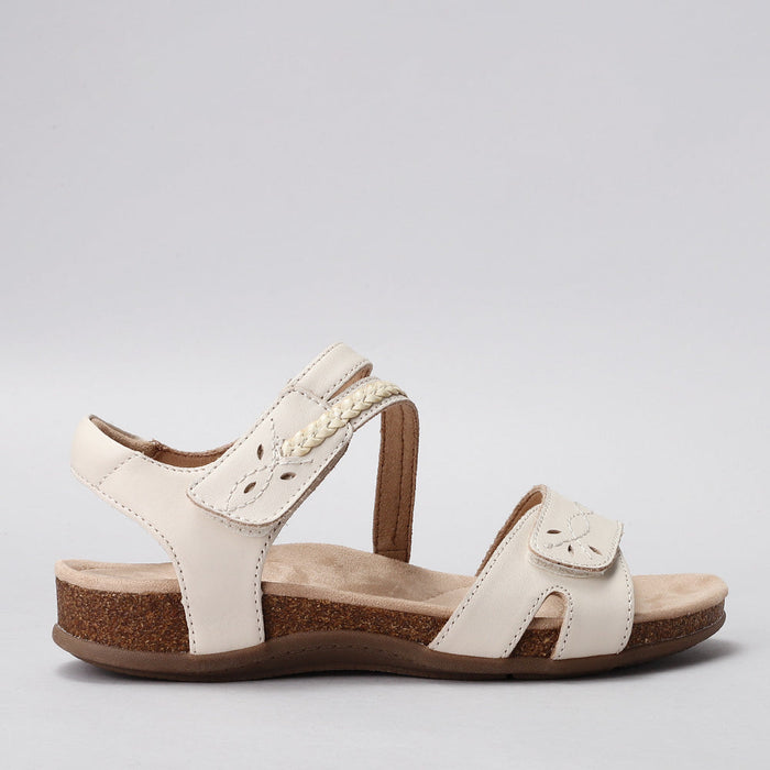 CC Resorts Ferro beige sandals with strappy design and flat sole, shown from the side.