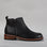Black LE SANSA FIG boots with sleek design and pointed toes, shown on a plain background.