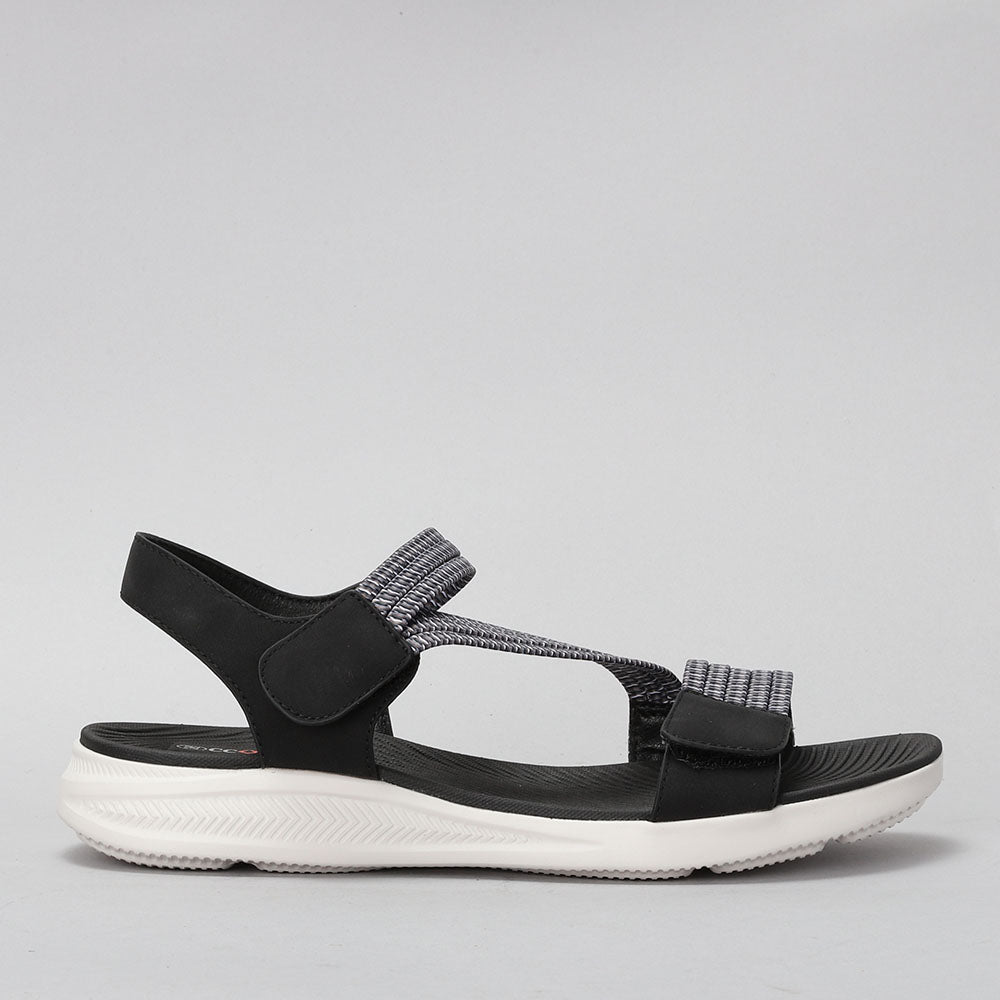 CC RESORTS FLORRIE black multi sandals shown from side view with stylish straps and wedge heel.