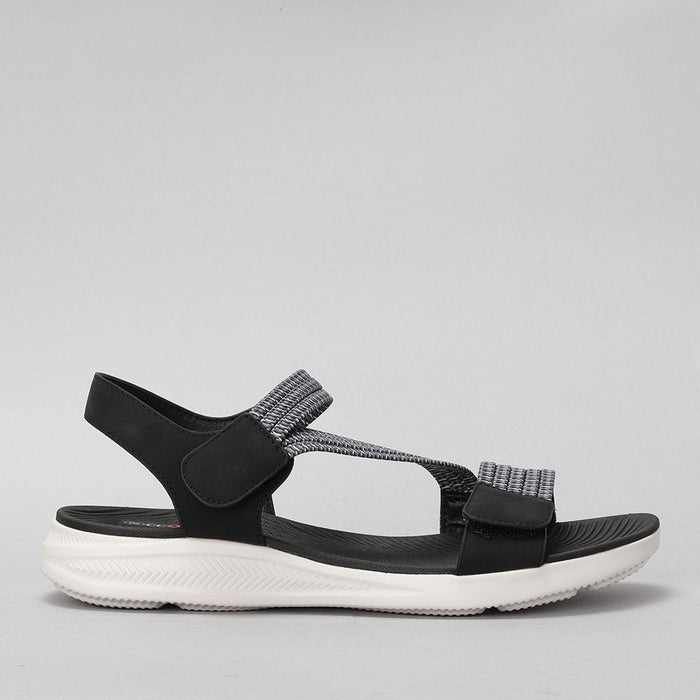 CC RESORTS FLORRIE black multi sandals shown from side view with stylish straps and wedge heel.