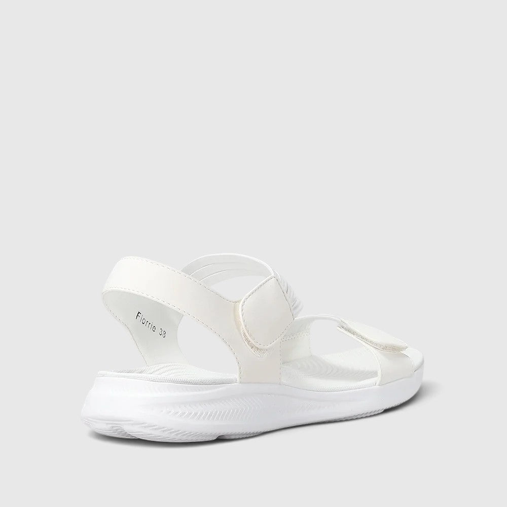 CC Resorts Florrie white sandals with strappy design, open toe, and flat sole, perfect for casual summer wear.