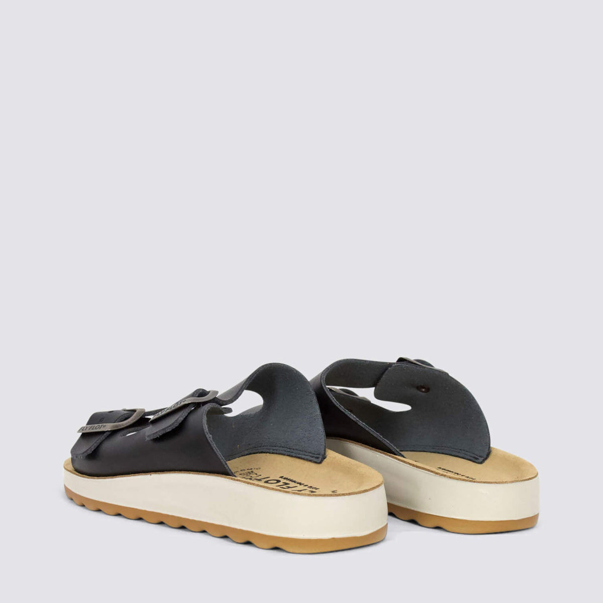 Black Fly Flot FLY FLOT 77G64 2C flats showing their sleek design and closed-toe style with subtle stitching details.
