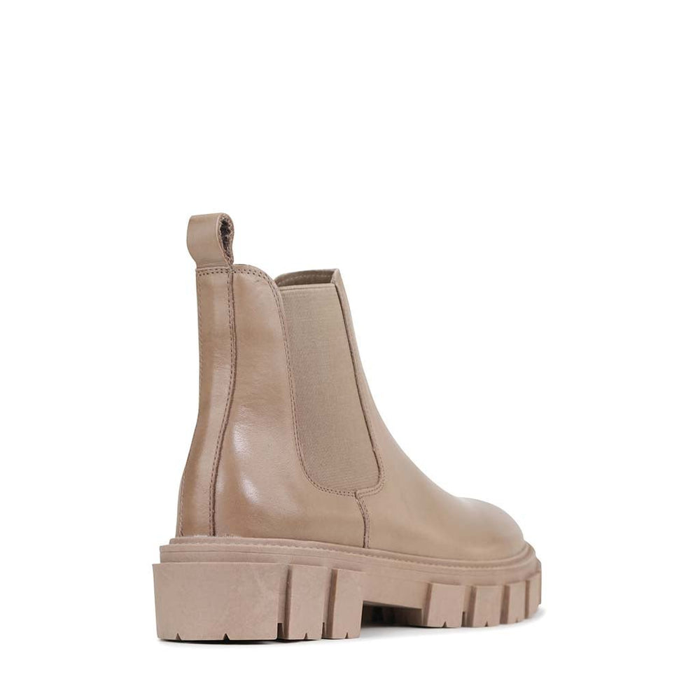Eos Fea taupe boots viewed from the back, showcasing the stylish heel and ankle design in a soft taupe color.