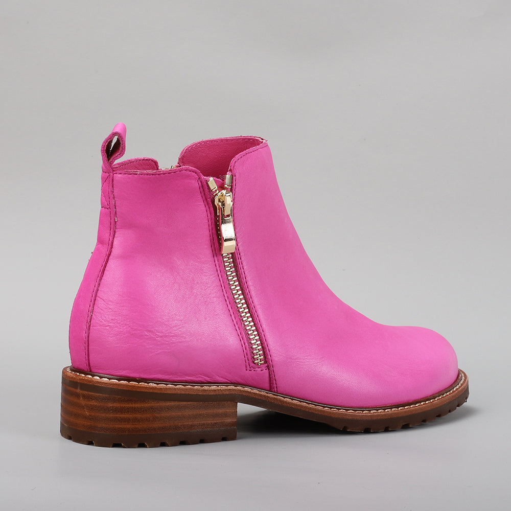 Le Sansa Fig Hot Pink boots with stylish design, featuring vibrant pink color and sleek silhouette for trendy fashion looks.