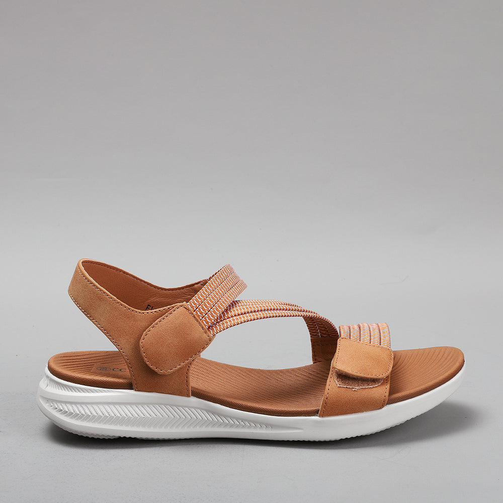 Tan CC RESORTS Florrie sandals with braided straps and flat soles for a stylish, comfortable summer look.