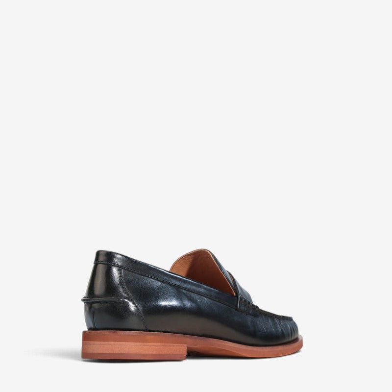 Black EOS Forte loafers displaying a sleek leather design with laces and a low heel on a neutral background.