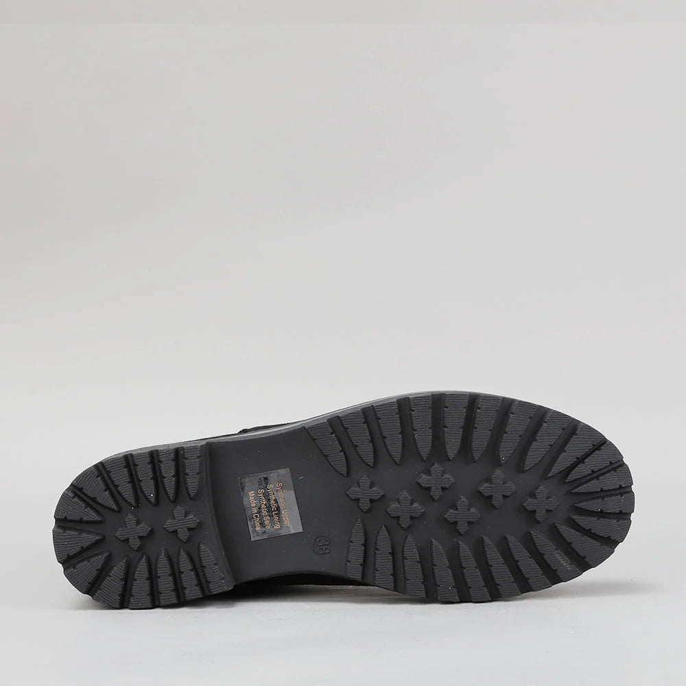 Black CC Resorts Gamilia boots with suede soles, stylish ankle-length footwear for casual and trendy outfits.