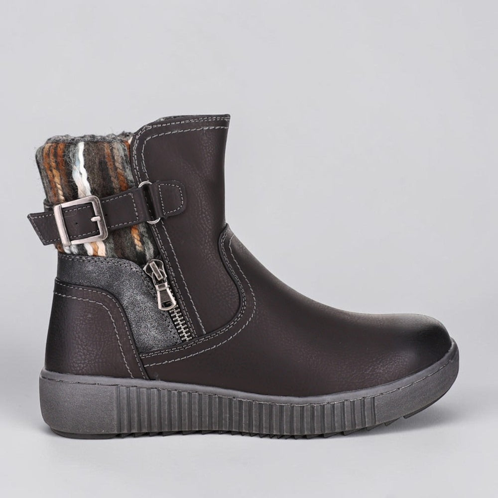 Black CC Resorts Garrett boots with side zipper and stylish ankle design, perfect for casual and outdoor wear.