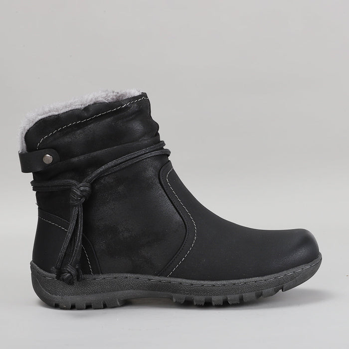 Black CC Resorts Gemma boots shown from the side, featuring sleek design and ankle-high silhouette.