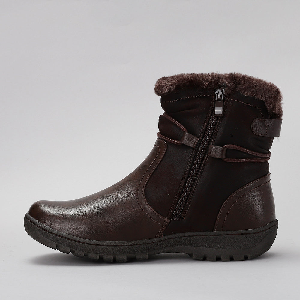 CC Resorts Gemma chocolate boots featuring a stylish design and comfortable fit, shown in a close-up image.