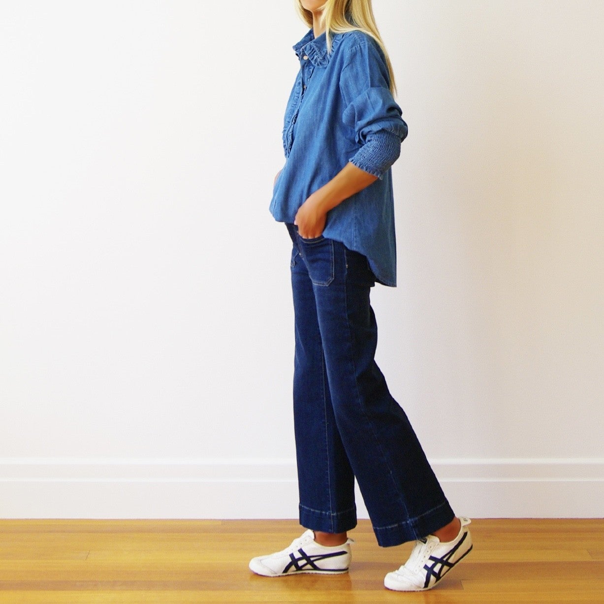 Light blue denim blouse from Who's Charlie Ella collection, featuring a relaxed fit and classic button-down style.