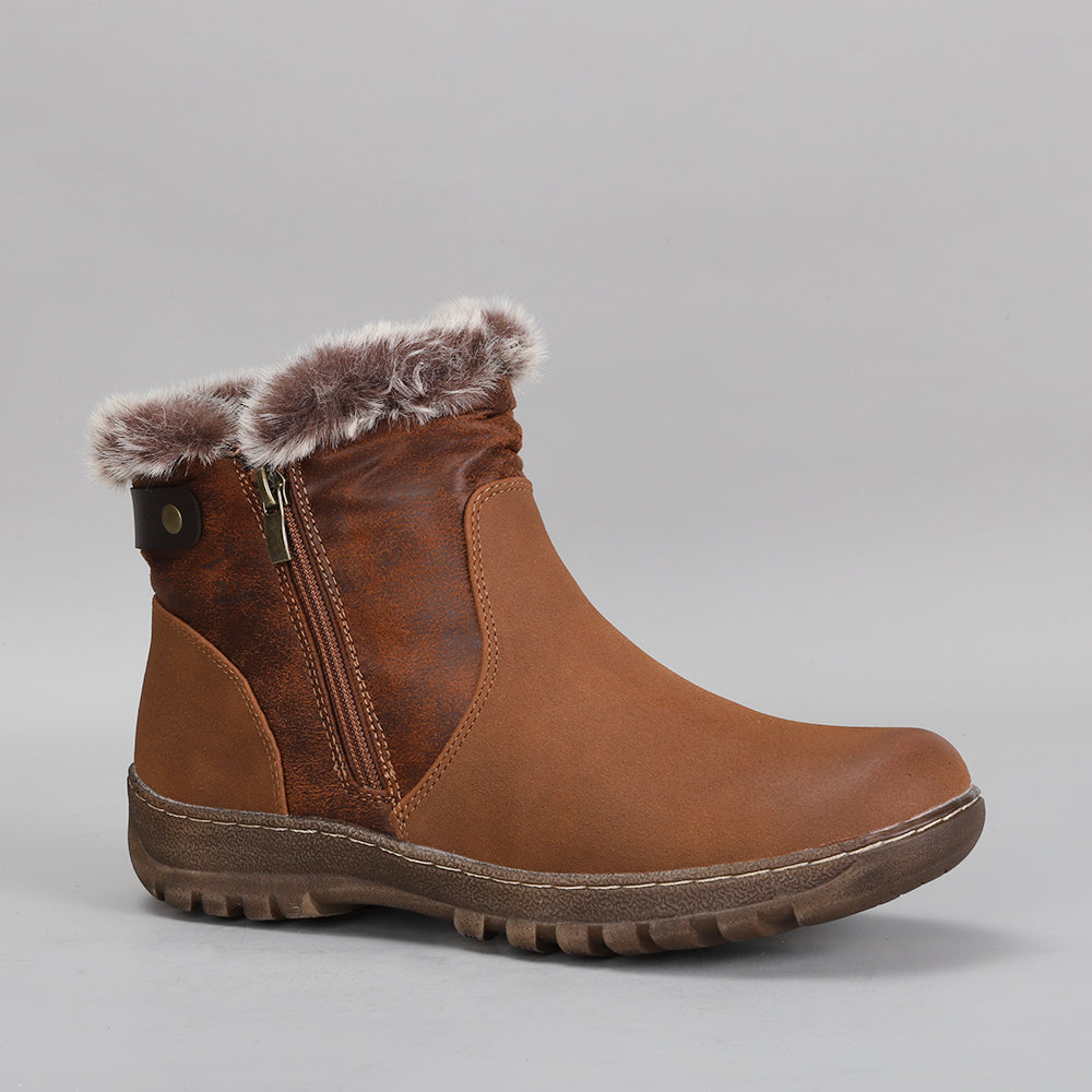 CC Resorts Ginger Brown boots with a sleek design, featuring a rounded toe and low heel, perfect for casual or stylish wear.