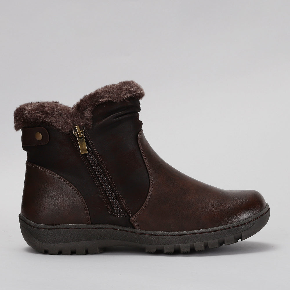 CC Resorts Ginger Chocolate boots shown from the side, featuring a stylish design with a comfortable fit and trendy appearance.