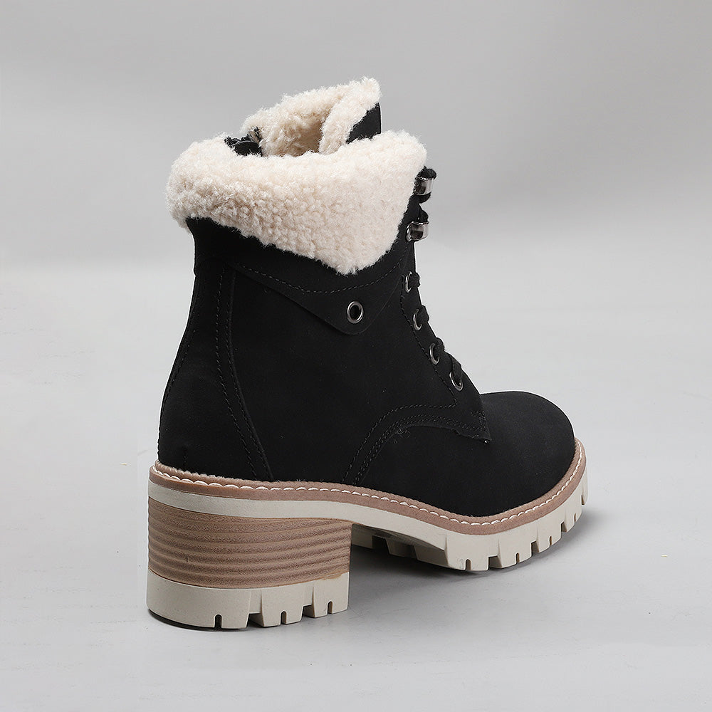 Black CC Resorts GOAT boots with stylish design, featuring a sleek silhouette and textured sole for a fashionable look.