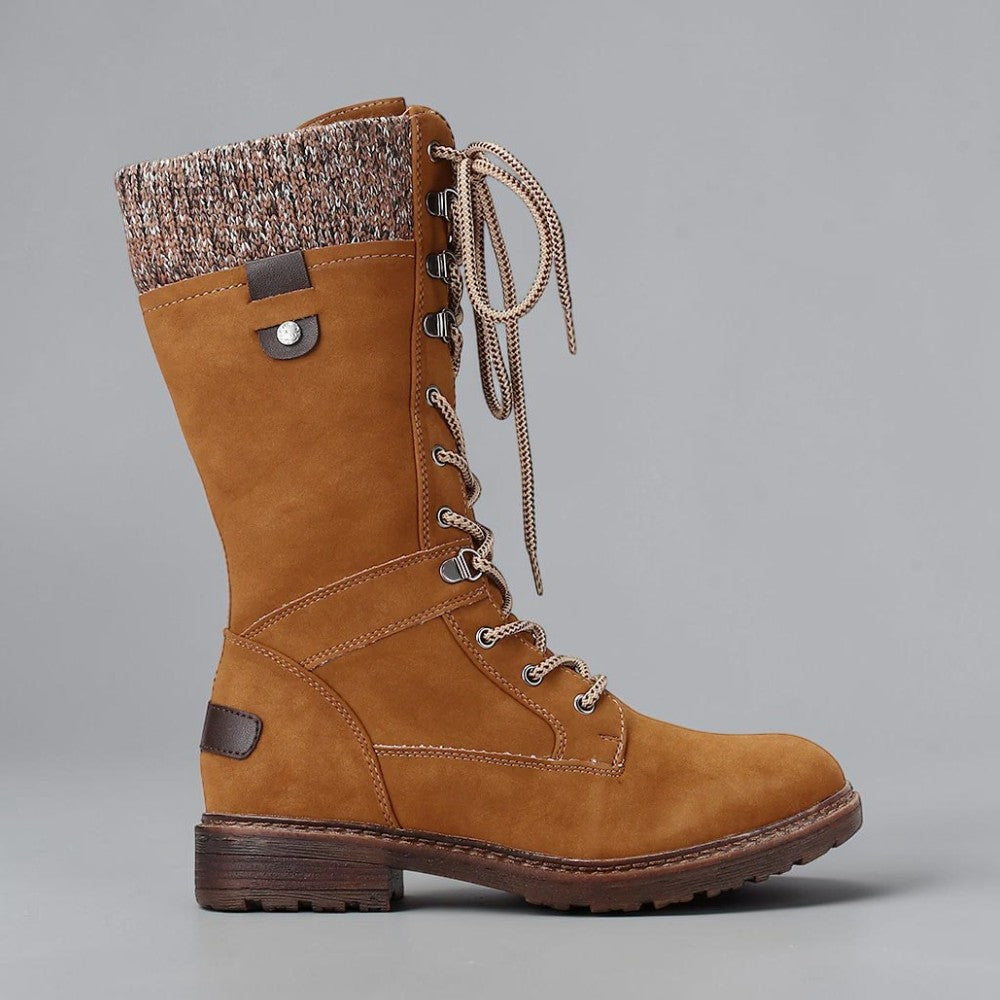 CC RESORTS Goldie chestnut boots shown from the side, featuring stylish ankle-high design and textured leather finish.