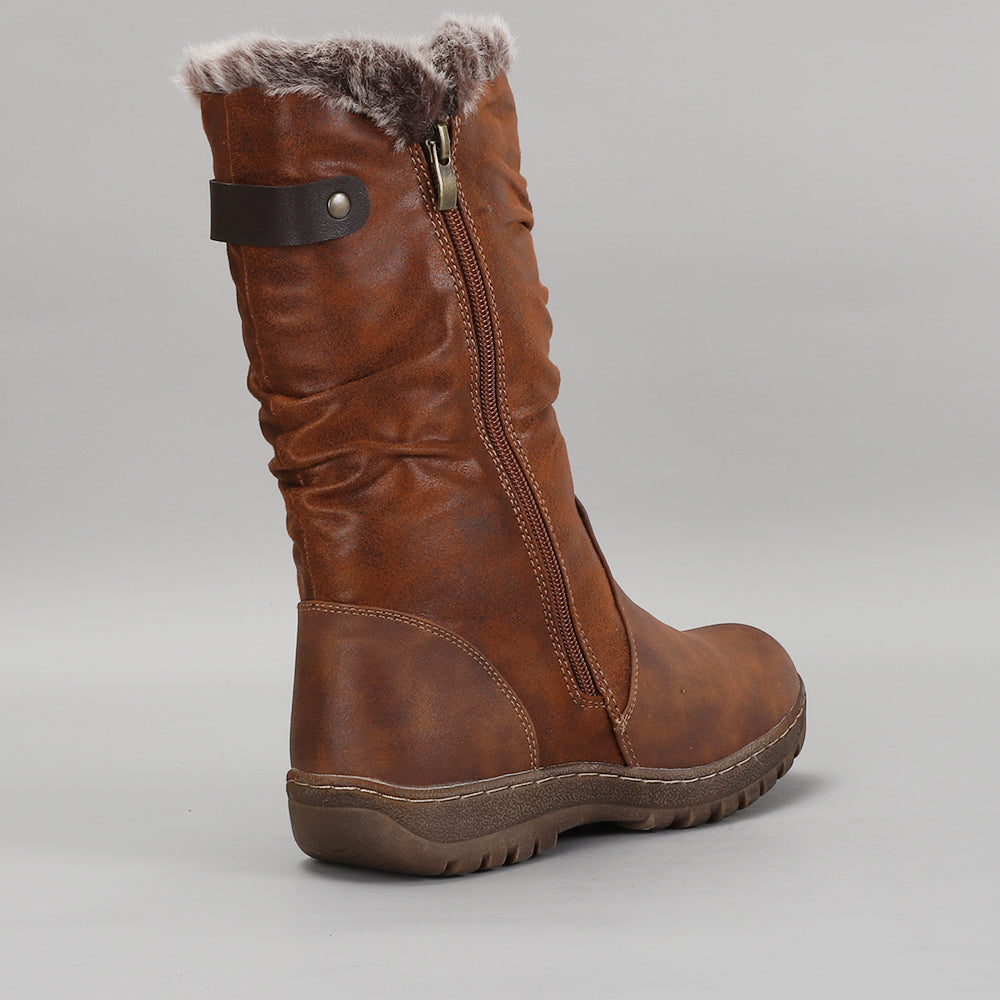 Brown CC Resorts Goose boots with fur lining and ankle height, stylish footwear for cold weather.