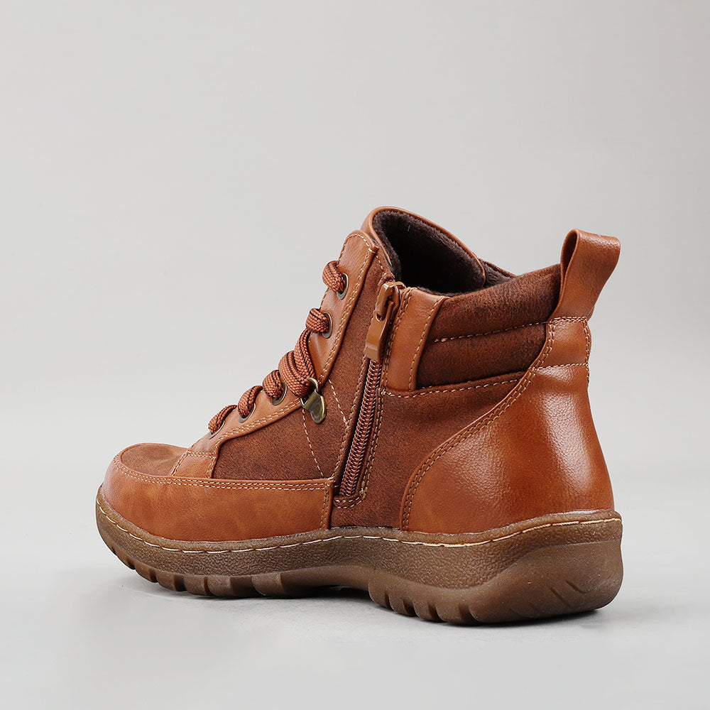 Brown CC Resorts Gowan boots with ankle-high design and stylish stitching, perfect for casual and outdoor wear.