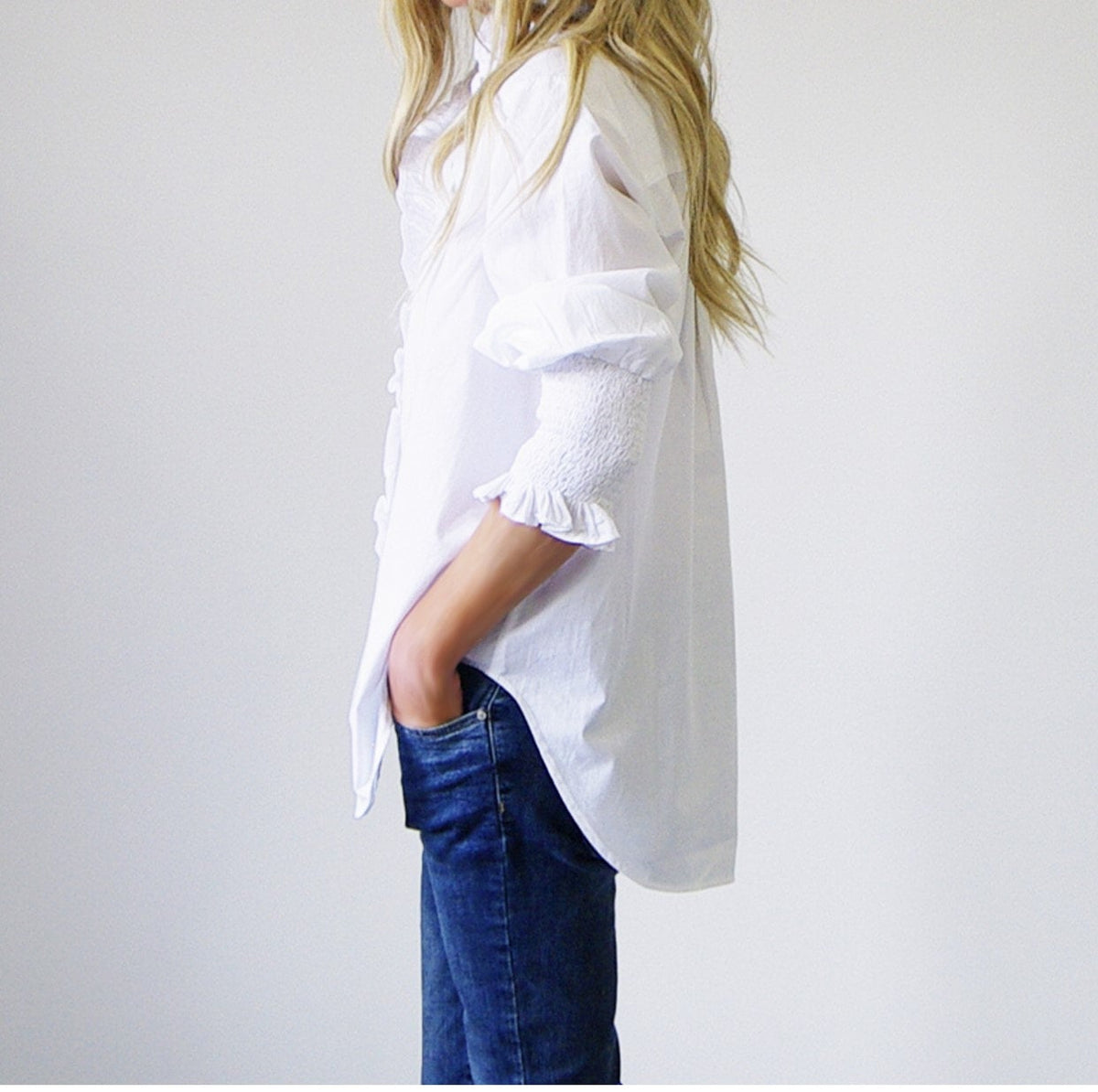 White Who's Charlie poppy blouse featuring a stylish, flowy design and elegant neckline, perfect for casual and dressy occasions.