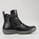 Black CC Resorts Greco boots shown from the side, featuring sleek design and ankle-high style with laces and sturdy sole.