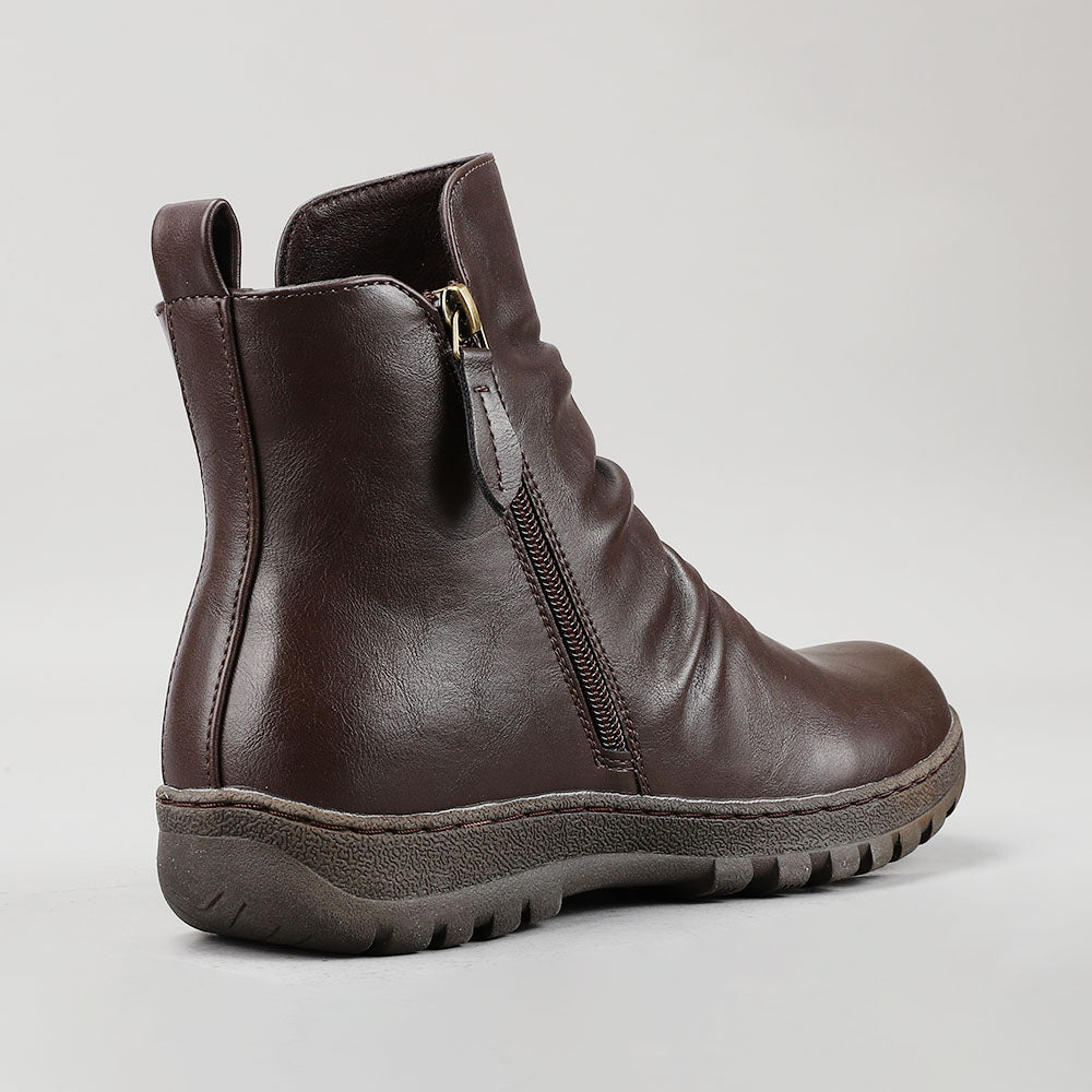 CC Resorts Greco Chocolate boots featuring a stylish design, brown leather material, and ankle-length silhouette.