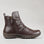 CC Resorts Greco Chocolate boots displayed from the side, featuring a stylish design and ankle-length style in rich chocolate color.