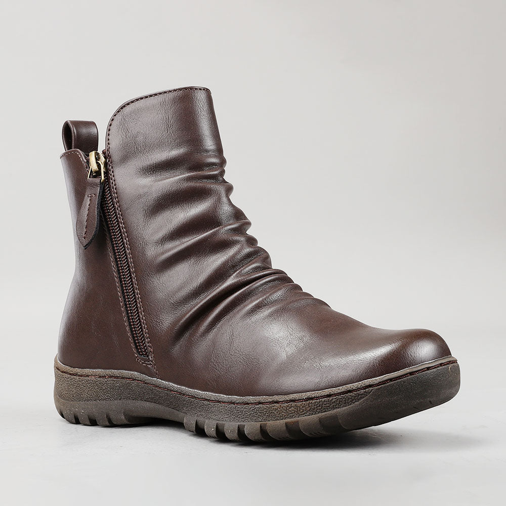 CC Resorts Greco Chocolate boots, stylish brown footwear with a sleek design, perfect for casual or outdoor wear.