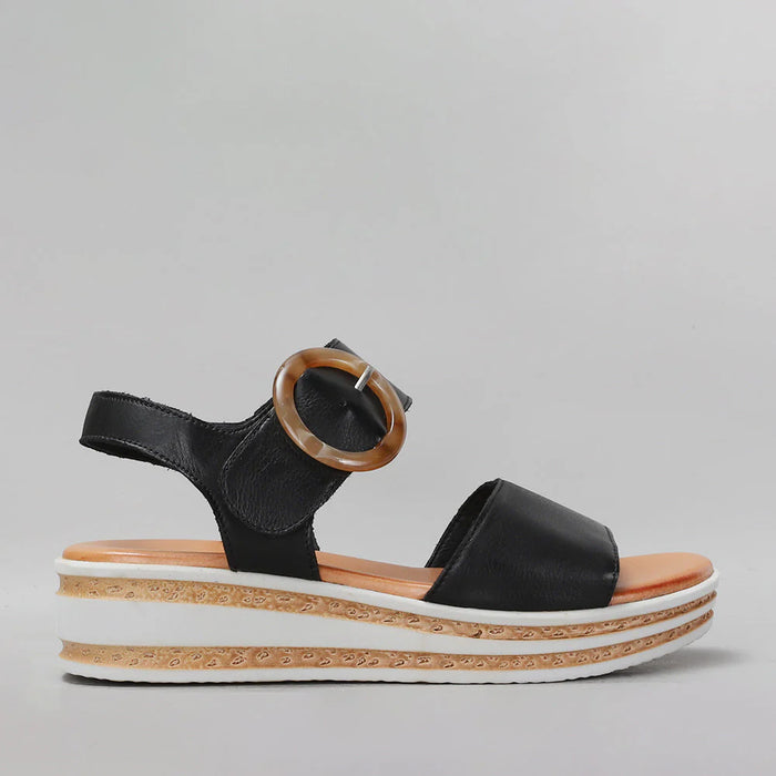Black Le Sansa Sansa Guard sandals with open toes and ankle straps, stylish footwear for casual wear.