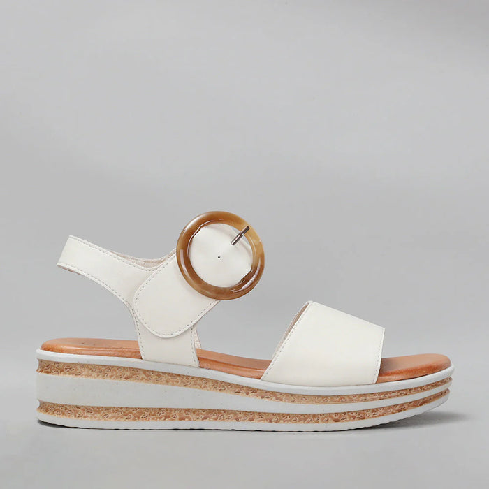 Le Sansa Guard Bone sandals with bone-colored straps and flat sole, casual open-toe design for comfortable summer wear.