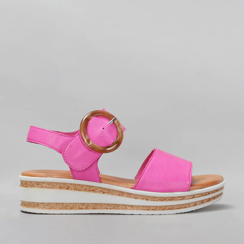 Le Sansa Guard hot pink sandals with strap design, featuring a vibrant color and comfortable slip-on style.