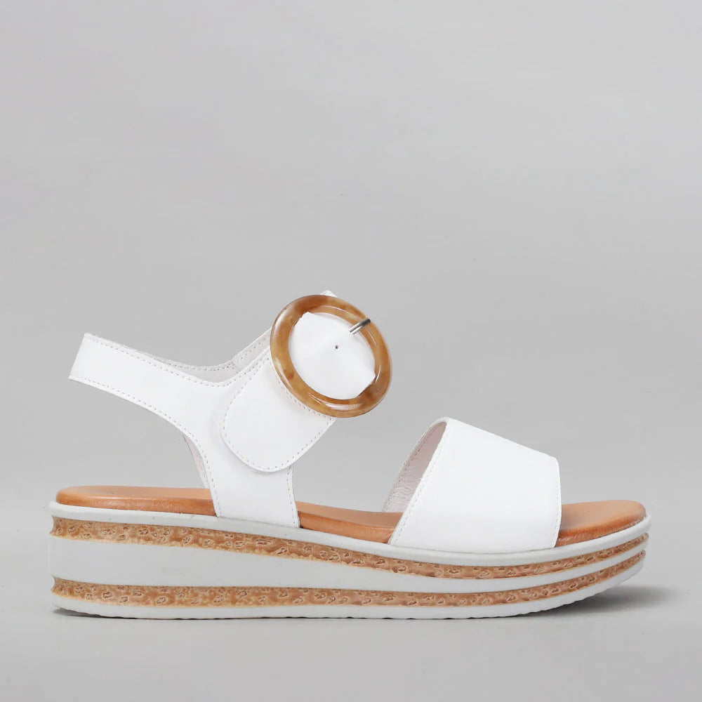 White Le Sansa Sansa Guard sandals with open toes and ankle straps, showcasing stylish and comfortable footwear.