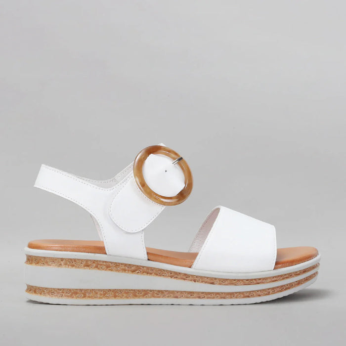 White Le Sansa Sansa Guard sandals with open toes and ankle straps, showcasing stylish and comfortable footwear.