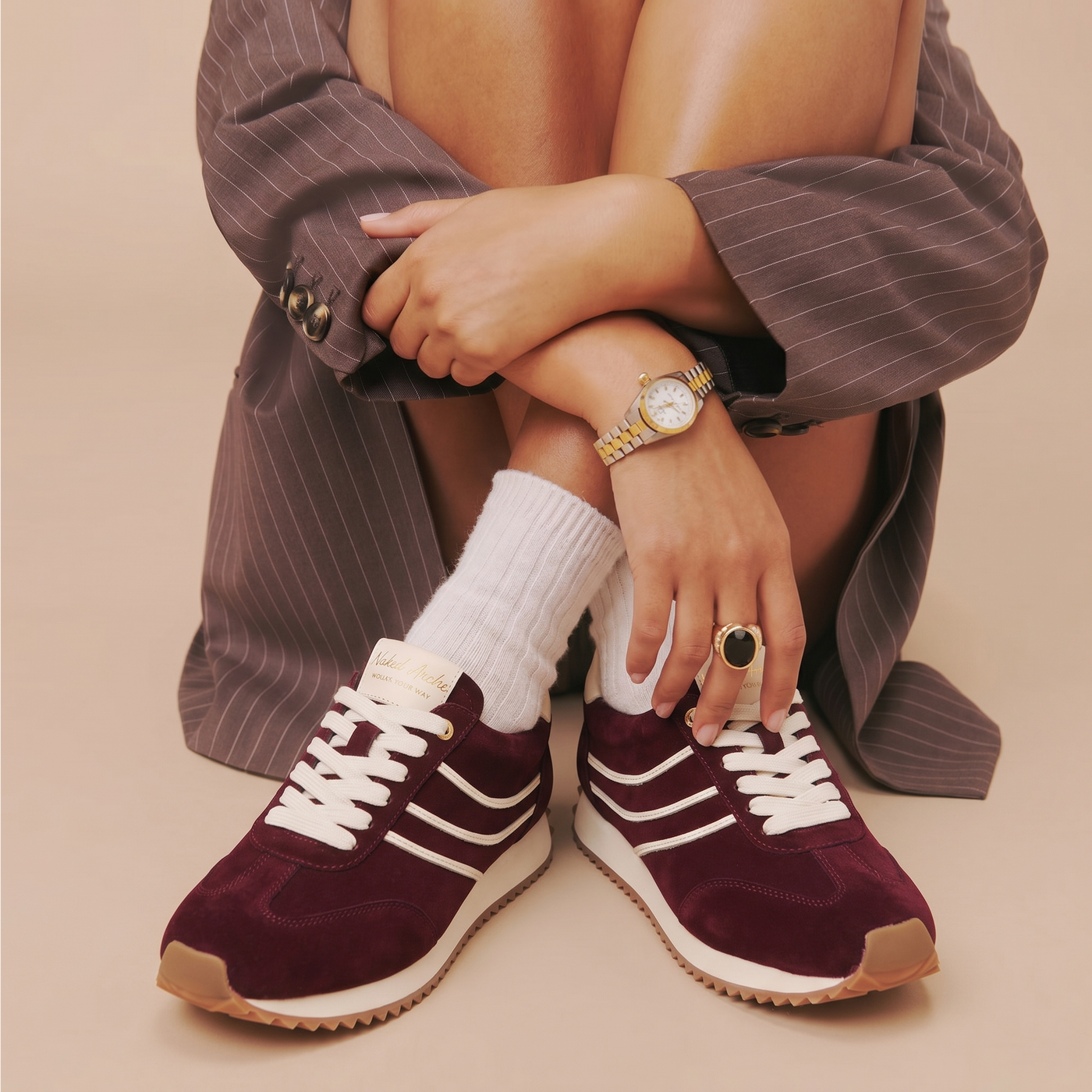 Naked Arches Wednesday Burgundy sneakers featuring sleek burgundy leather and minimalist design with white soles.