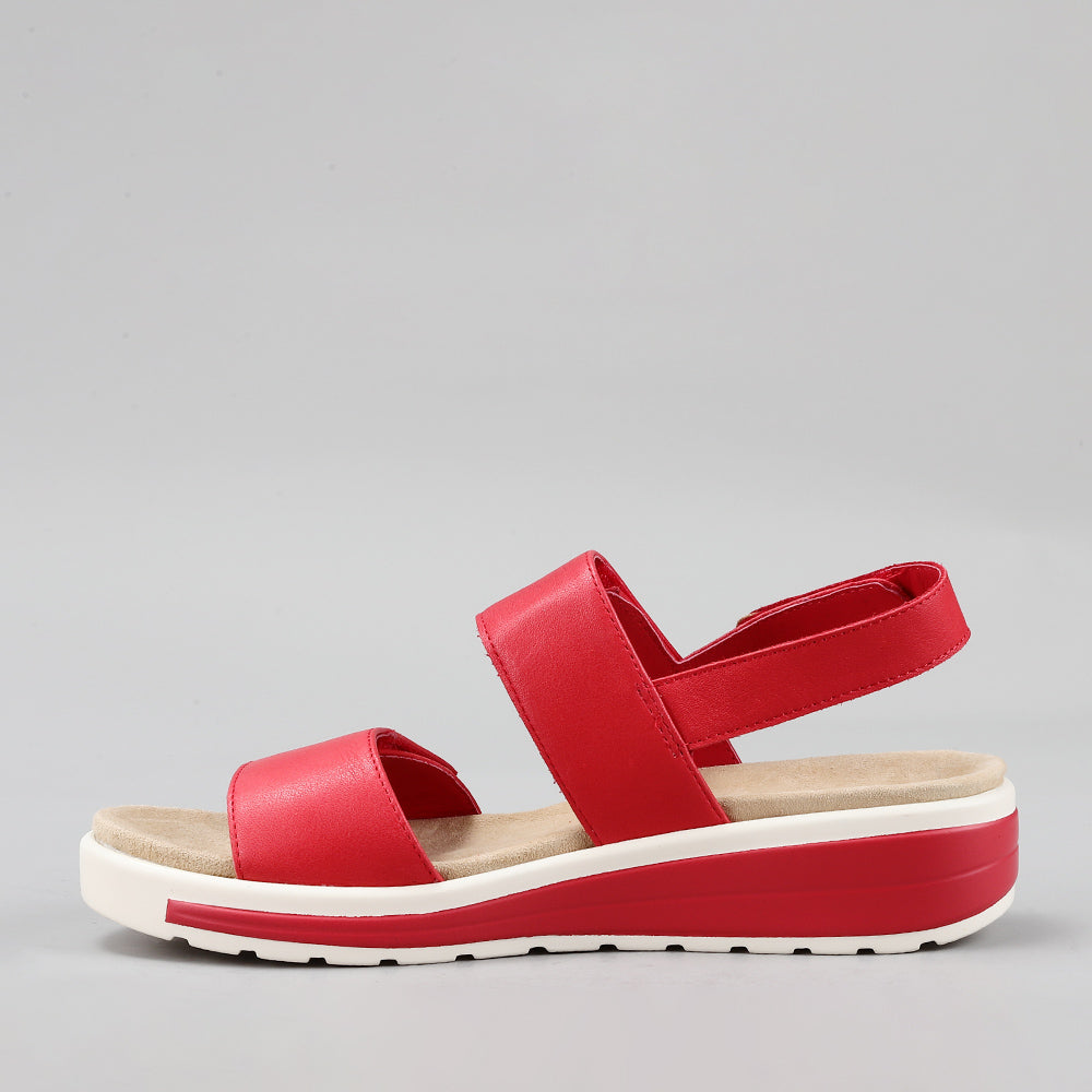 Dark red Naked Arches Hanza sandals with open-toe design and adjustable straps, displayed on a neutral background.