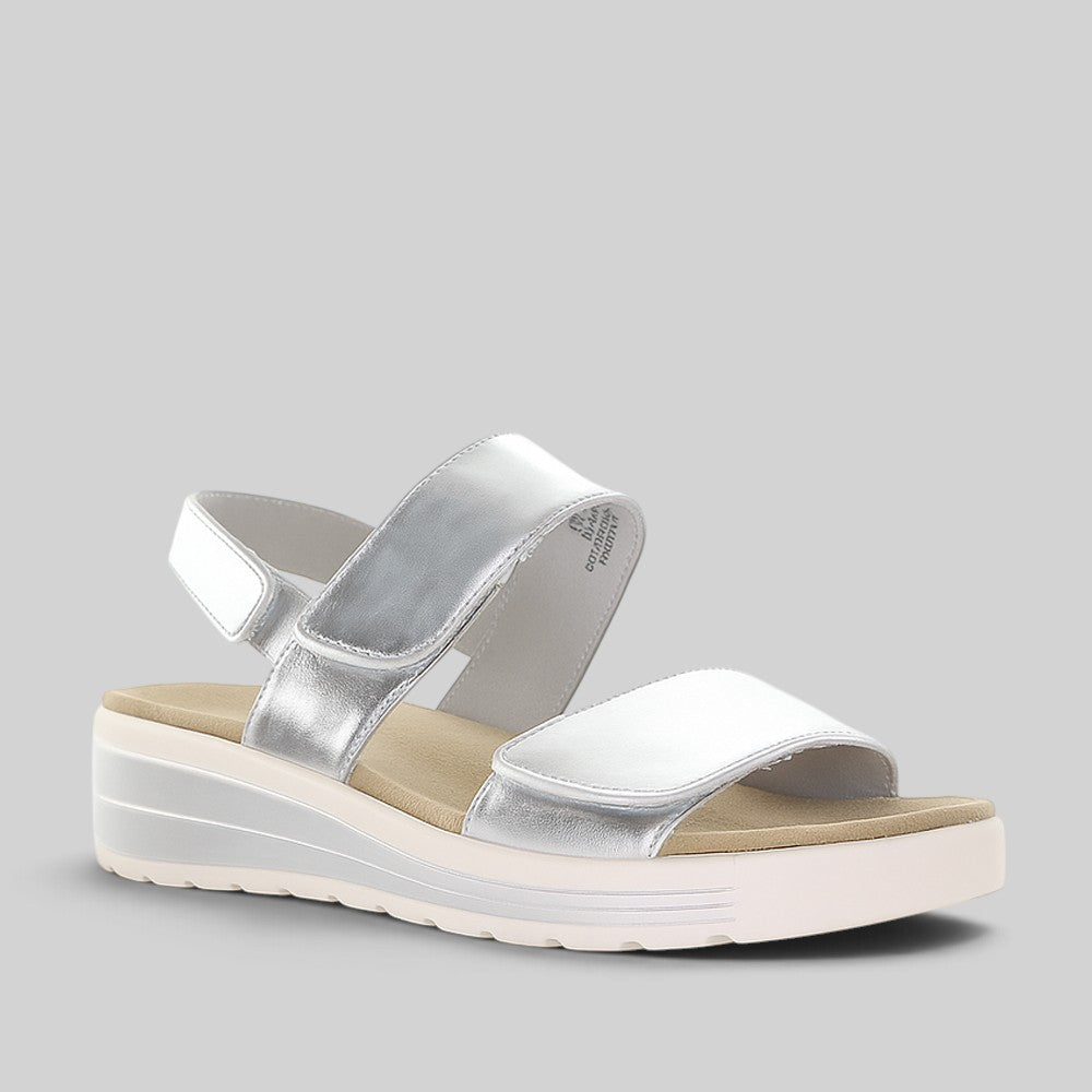 Naked Arches Hanza Silver sandals with silver straps and open-toe design, displayed on a neutral background.