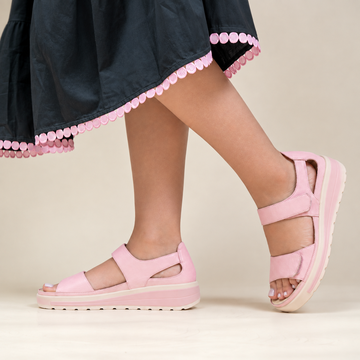 Naked Arches Happy Baby Pink sandals for infants, featuring soft pink straps and comfortable design for little feet.