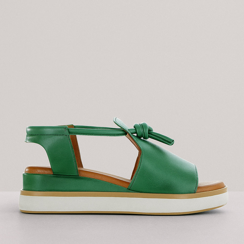 Le Sansa HIDE PINE sandals with brown leather straps and cushioned soles, displayed on a neutral background.