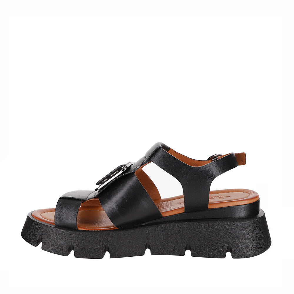 Black leather sandals from Le Sansa, style Hindi, featuring open toes and ankle straps.