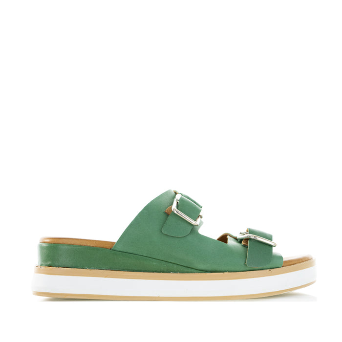 Le Sansa Holister Pine slip-on shoes with a sleek design and green pine color, ideal for casual wear.