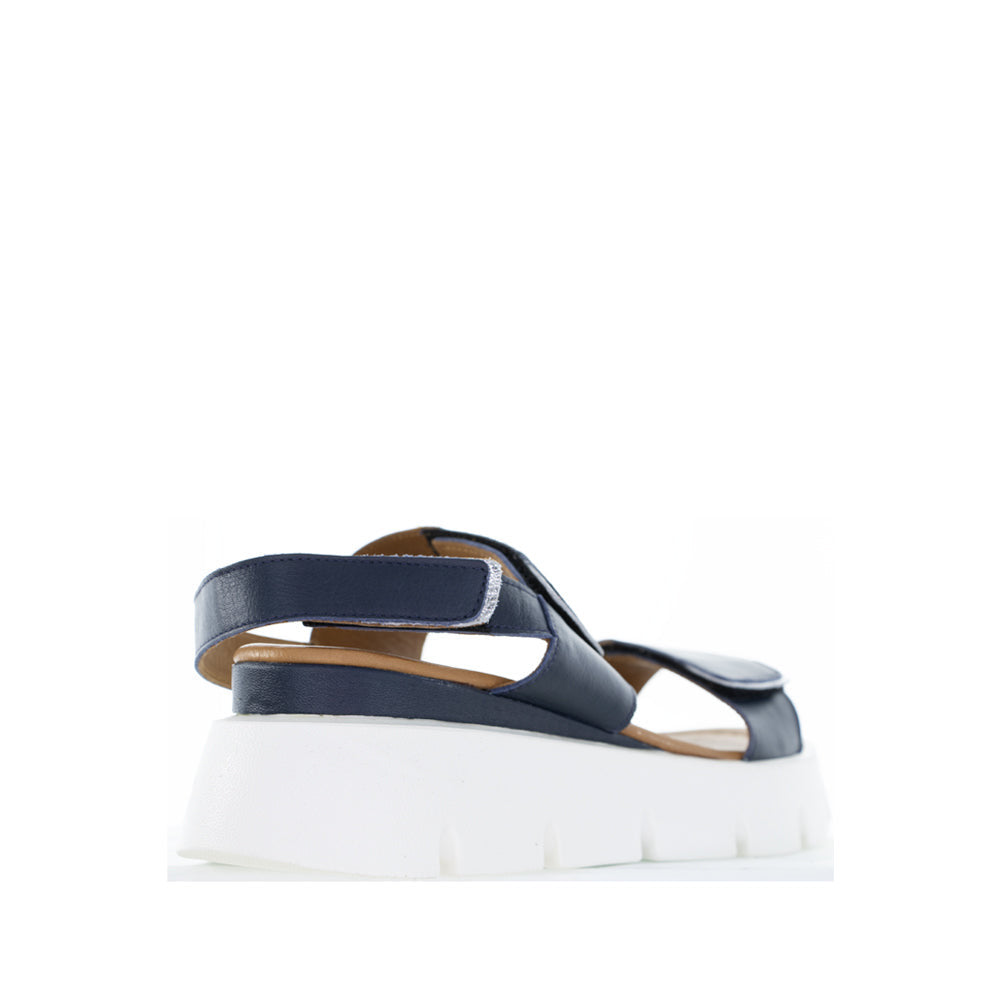 Le Sansa navy and silver handle sandals with sleek straps and comfortable design, perfect for casual or dressy occasions.