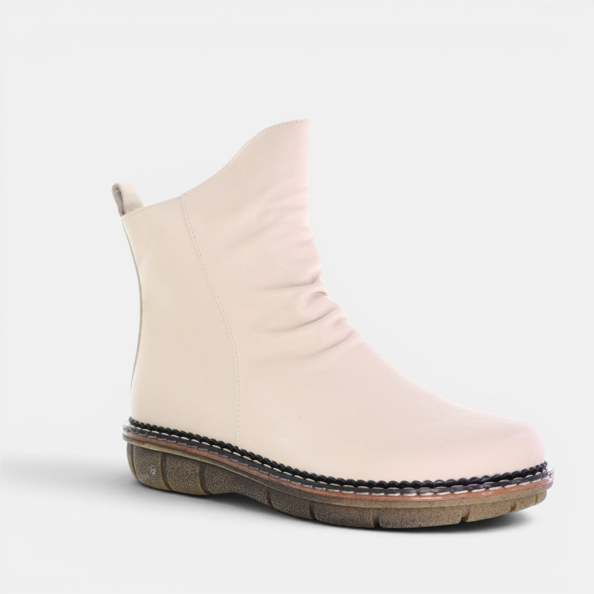 Le Sansa Noor Vanilla boots featuring a sleek design with a smooth vanilla-colored finish and stylish ankle height.