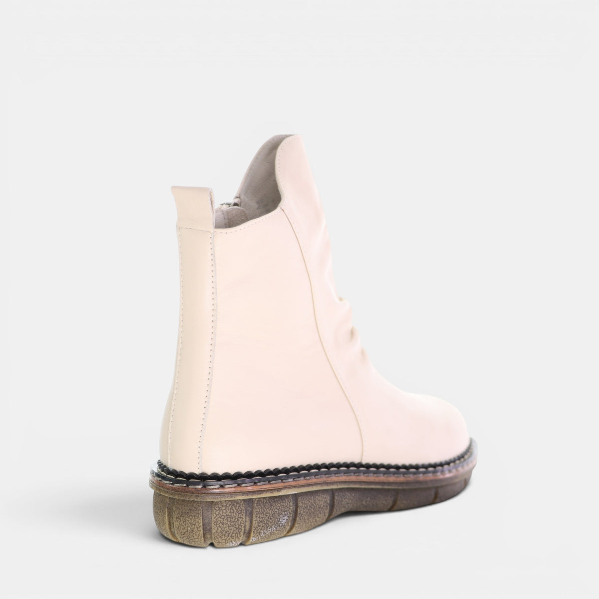 Le Sansa Noor Vanilla boots with sleek design and beige color, featuring a comfortable fit and stylish ankle length.