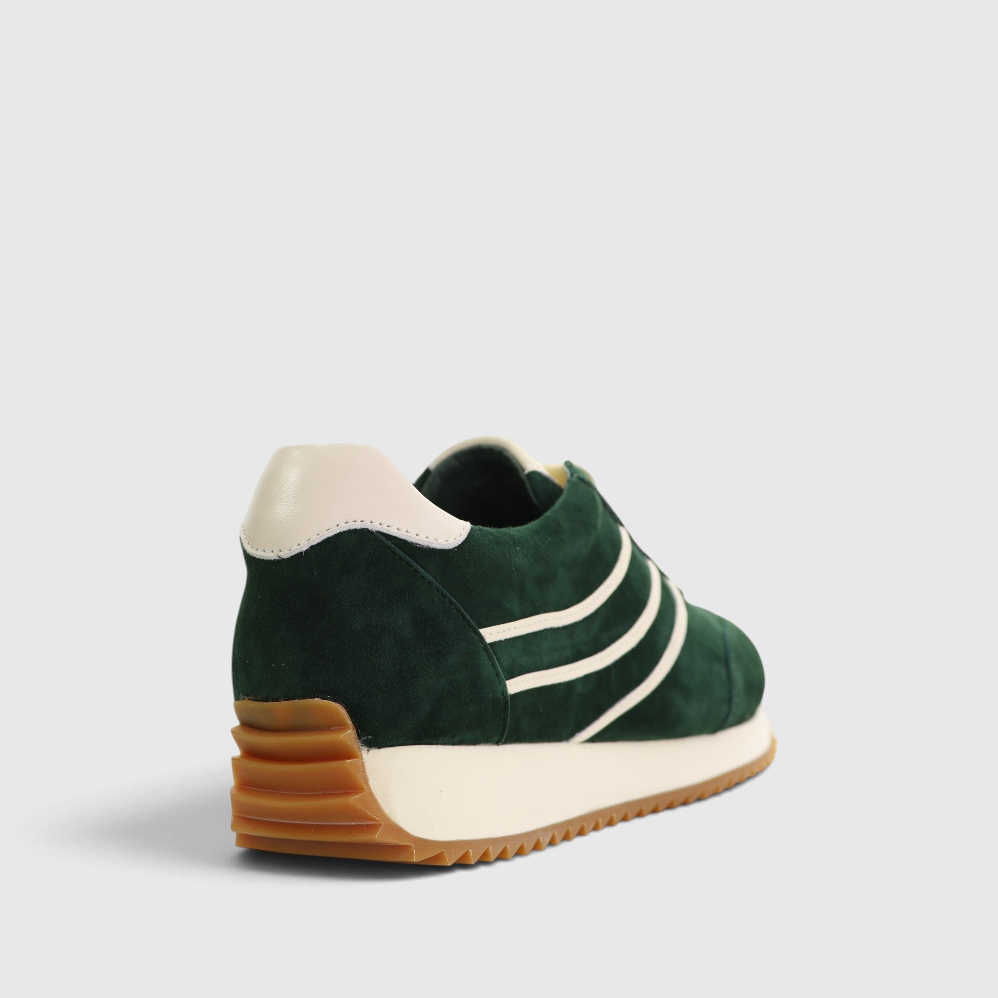 Naked Arches Wednesday DK green sneakers with white soles and laces, showcasing a stylish casual footwear design.