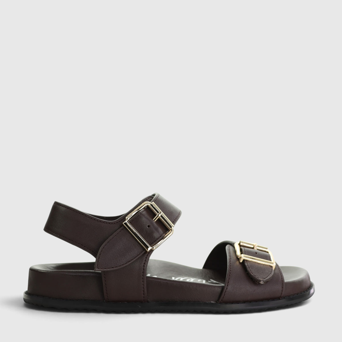 Naked Arches Ziggro Chocolate sandals with brown leather straps and cushioned footbed, displayed on a neutral background.