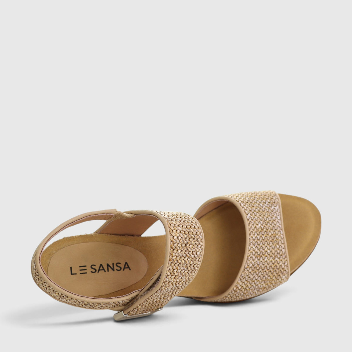 Le Sansa Evita beige raffia sandals with open toes and ankle straps, featuring a stylish woven raffia design for summer wear.